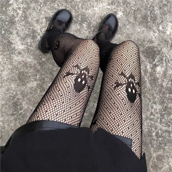 Collants résille à motif tête de mort et étoile 