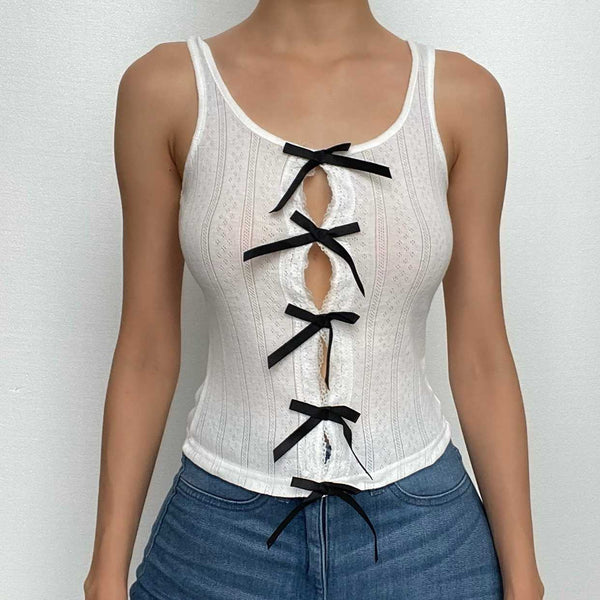 Haut texturé sans manches à découpes contrastées et à nœud papillon 
