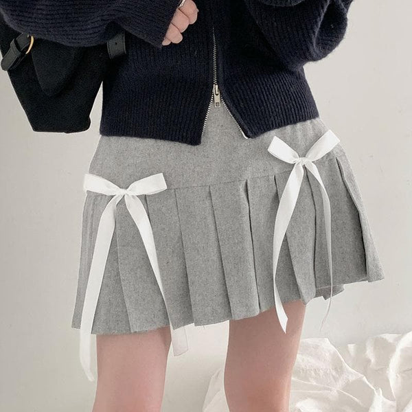 Mini-jupe trapèze taille haute plissée avec nœud papillon contrasté 