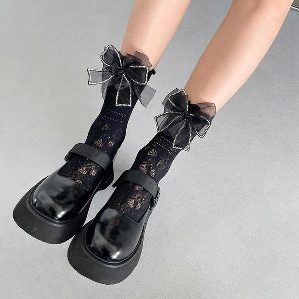 Chaussettes longues unies en dentelle de gaze avec nœud papillon 